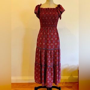 Super lightweight and comfortable boho dress. It is brand new with tags .